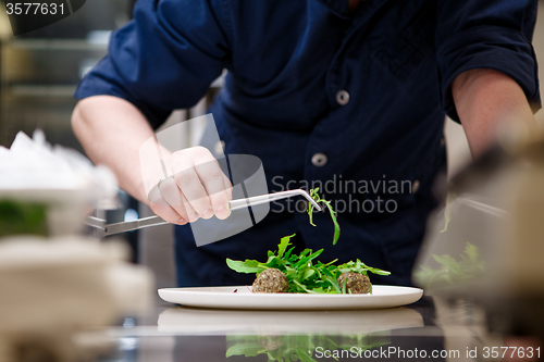 Image of Chef in hotel or restaurant, only hands