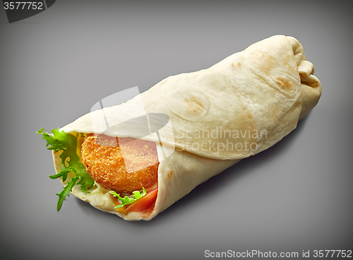 Image of Wrap with fried chicken and vegetables