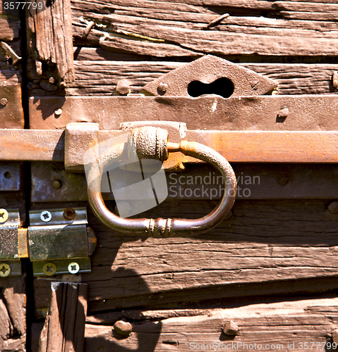 Image of crugnola abstract in a  door curch  closed wood italy  lombardy 