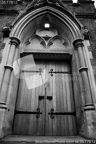 Image of wooden parliament in london old church door and marble antique  