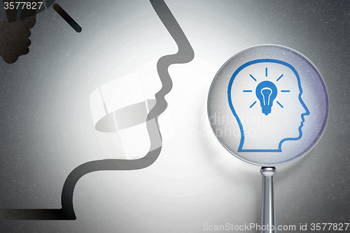 Image of Information concept:  Head With Lightbulb with optical glass on digital background