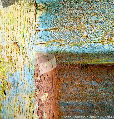 Image of colorated green wood as a window door 