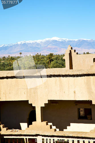 Image of brown  tower  old  construction in  africa morocco  near the sky