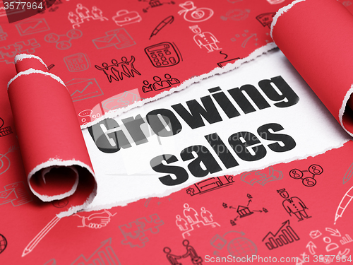 Image of Finance concept: black text Growing Sales under the piece of  torn paper