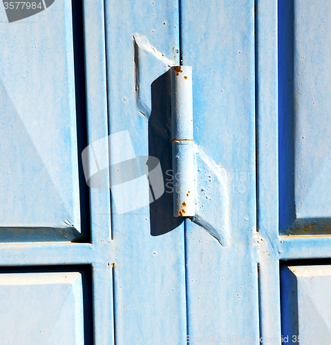 Image of blue hinges      rusty      morocco in africa the old wood  faca