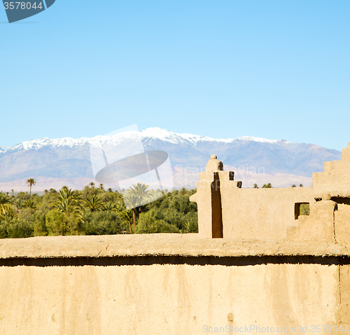 Image of brown  tower  old  construction in  africa morocco and  clouds  