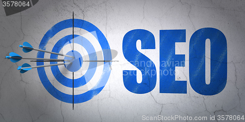 Image of Web development concept: target and SEO on wall background
