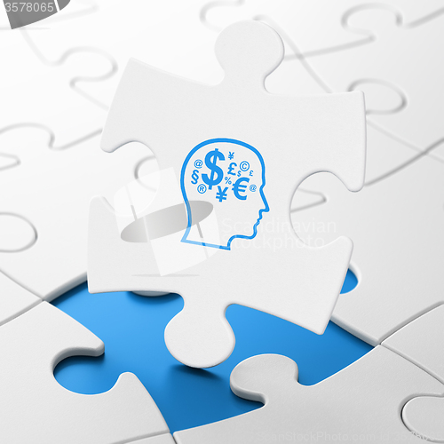 Image of Finance concept: Head With Finance Symbol on puzzle background