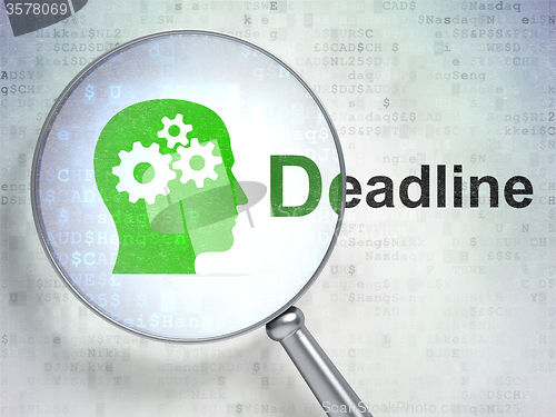 Image of Business concept: Head With Gears and Deadline with optical glass