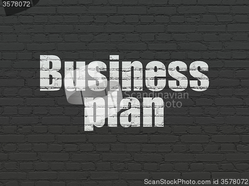 Image of Business concept: Business Plan on wall background