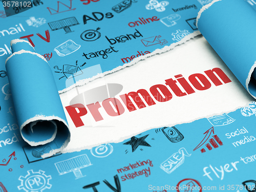Image of Advertising concept: red text Promotion under the piece of  torn paper