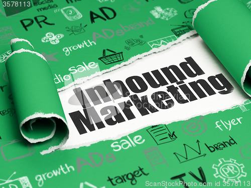 Image of Marketing concept: black text Inbound Marketing under the piece of  torn paper