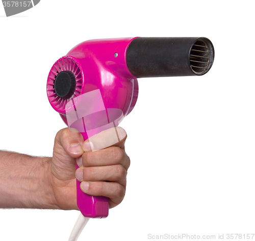 Image of Old pink hairdryer in hand