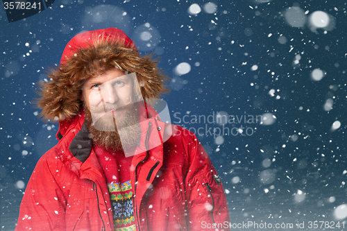 Image of Handsome man in winter snow