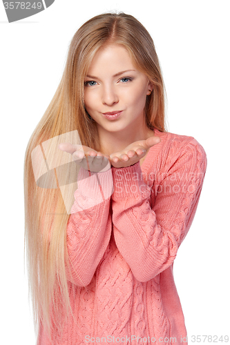 Image of Woman blowing a kiss
