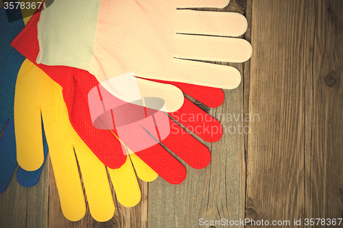 Image of set of four colored construction gloves