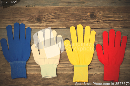 Image of working multicolored gloves