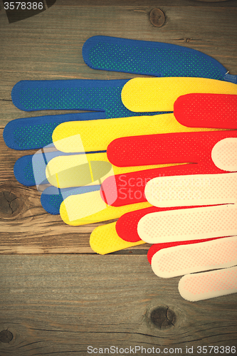 Image of construction gloves on an old workbench