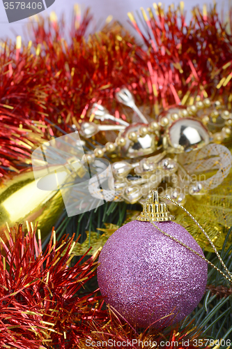Image of Closeup of Christmas balls and green fir tree branch, new year invitation card