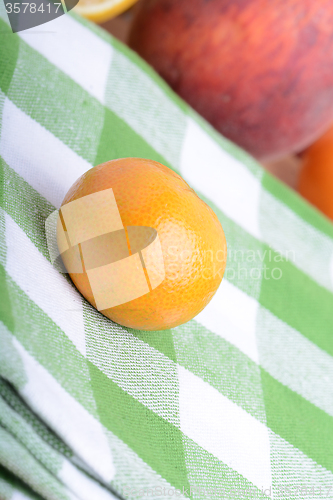 Image of many different fruits for the health of the entire family, peach, mandarin, strawberry slices