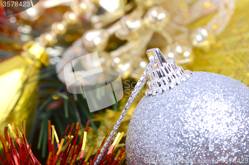 Image of Closeup of Christmas balls and green fir tree branch, new year invitation card