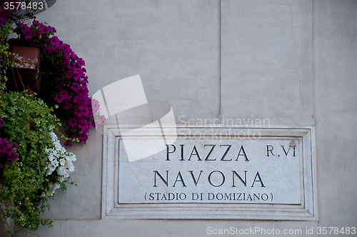Image of Road sign indicating a street name in Italian "piazza Navona" in