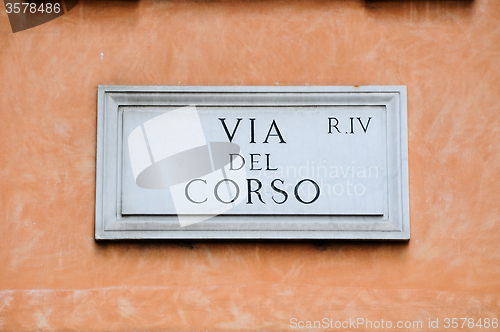 Image of Road sign indicating a street name in Italian "Via del corso " i