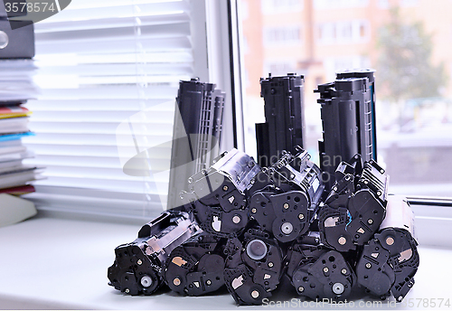 Image of Cartridges from the printer stacked on the windowsill Office