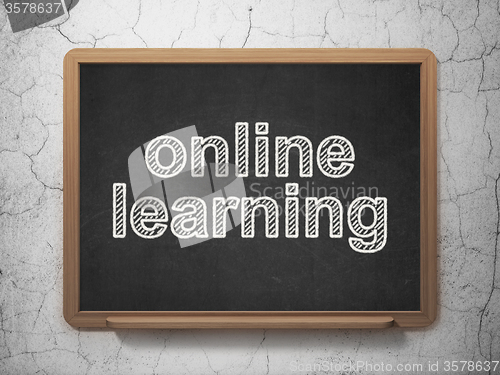 Image of Education concept: Online Learning on chalkboard background