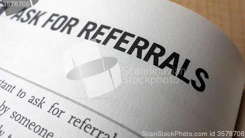 Image of Ask for referrals word on a book