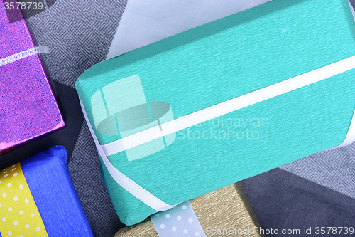 Image of bright gifts with ribbons, holiday invitation card