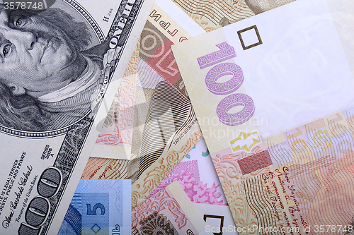 Image of Ukrainian hryvnia and the american dollars