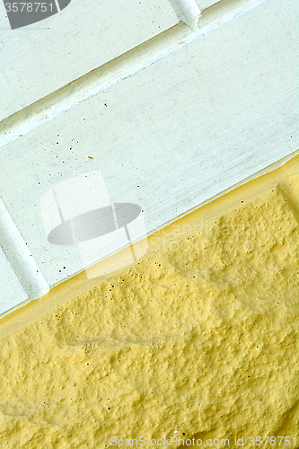 Image of white and yellow brick wall texture