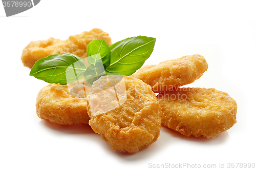Image of Chicken nuggets and basil leaf