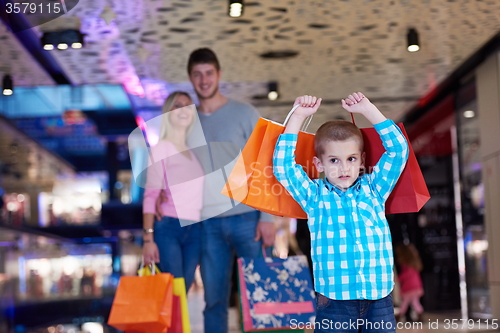 Image of young family with shopping bags