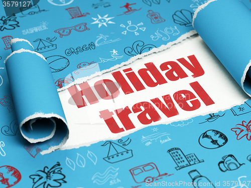 Image of Tourism concept: red text Holiday Travel under the piece of  torn paper