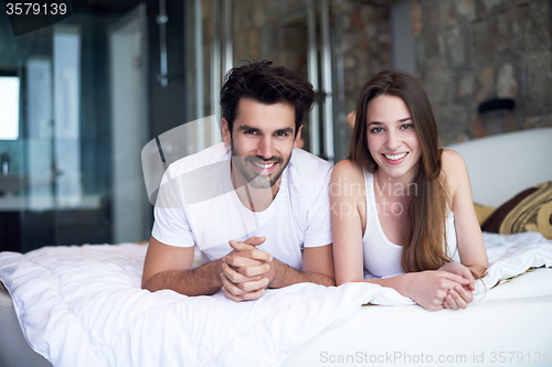 Image of couple relax and have fun in bed