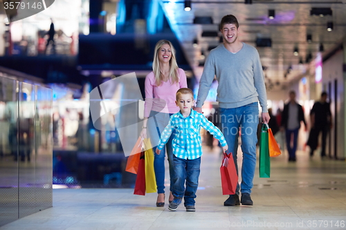 Image of young family with shopping bags