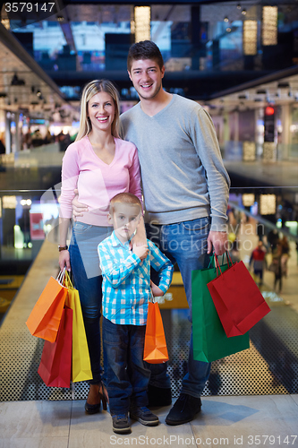 Image of young family with shopping bags