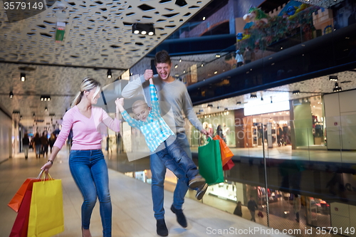 Image of young family with shopping bags