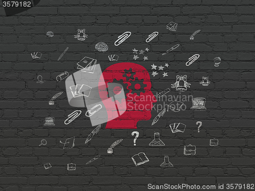 Image of Learning concept: Head With Gears on wall background
