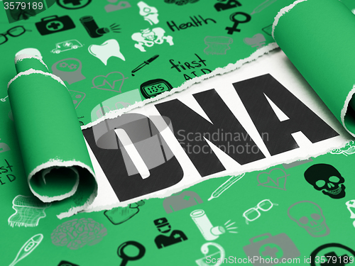 Image of Medicine concept: black text DNA under the piece of  torn paper