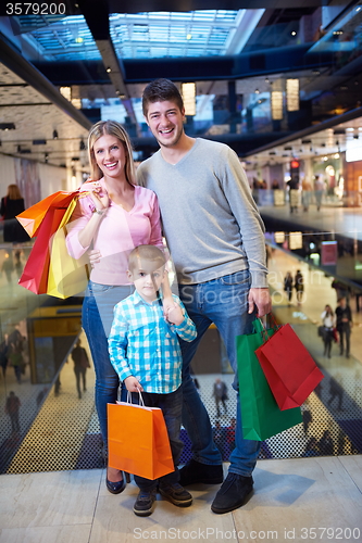 Image of young family with shopping bags