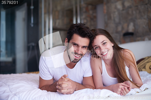 Image of couple relax and have fun in bed