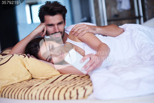 Image of couple relax and have fun in bed