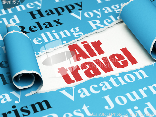 Image of Travel concept: red text Air Travel under the piece of  torn paper