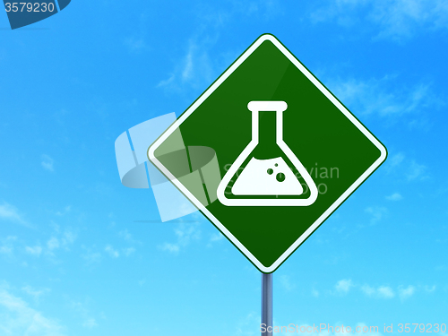Image of Science concept: Flask on road sign background