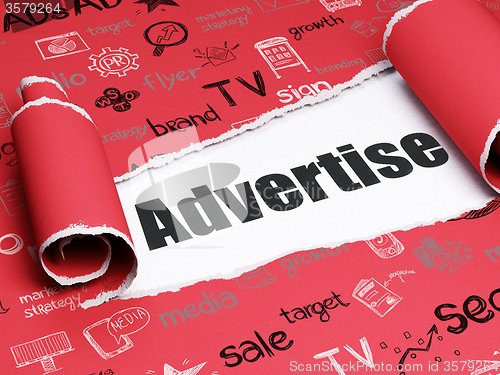 Image of Advertising concept: black text Advertise under the piece of  torn paper