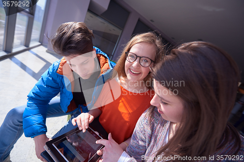 Image of students group working on school  project  together