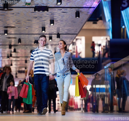 Image of young couple with shipping bags